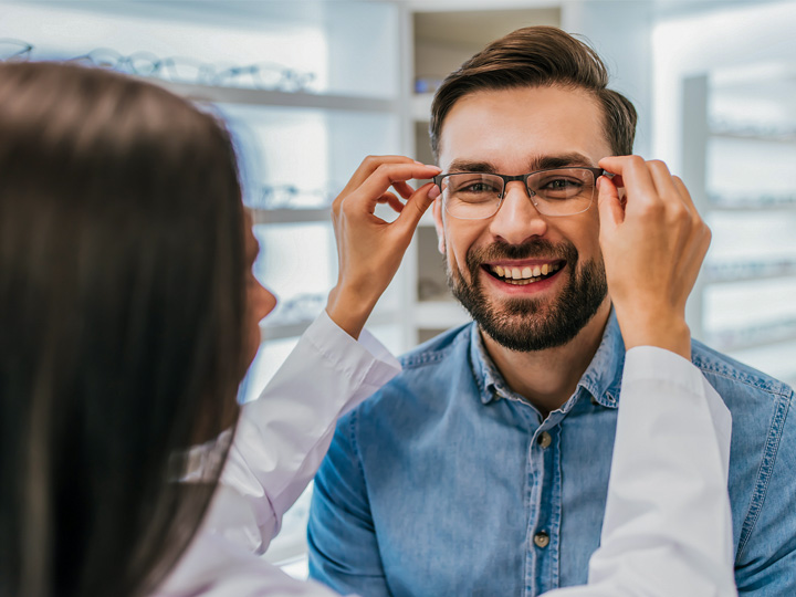 Man getting an eyeglass fitting