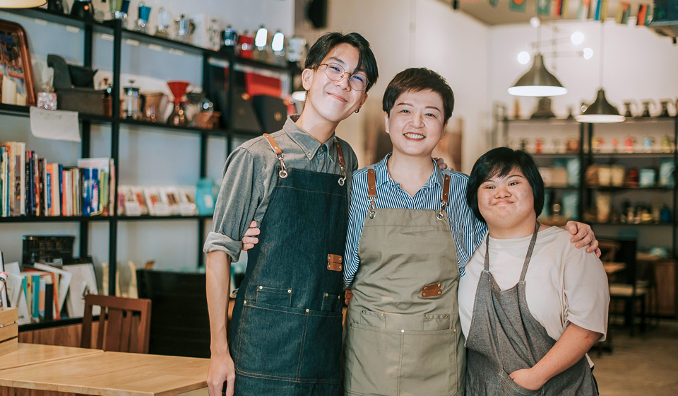 Family that receives employment support at work in shop