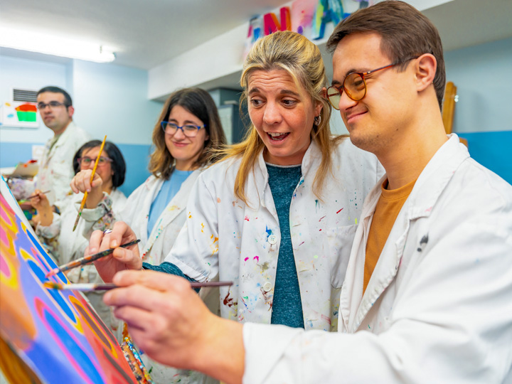 Developmentally disabled man particpating in art and crafts.