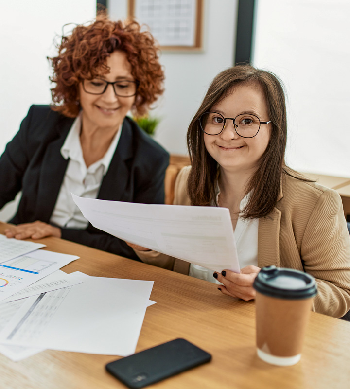 Developmentally disabled office worker with job coach