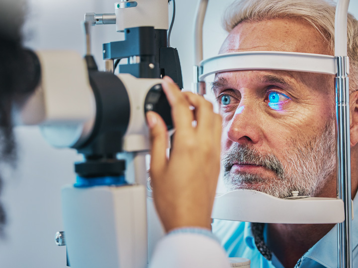 man receiving eye exam from the low vision team at VisAbility