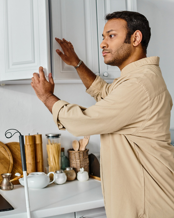 Vision impaired man working in the kitchen