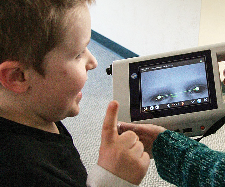 child receiving vision screening at school