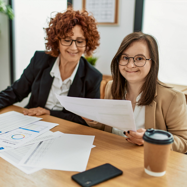 Developmentally disabled office worker with job coach