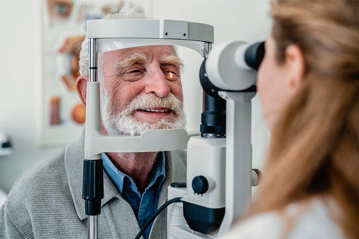 An older man receives a comprehensive low vision examination