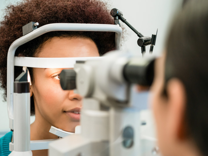 A woman receives her annual vision exam